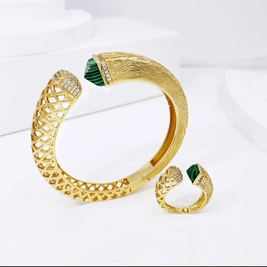 Emerald green stone cuff bangle and ring made in 18 karat gold plating with high grade Swarovski crystals and synthetic emerald stone