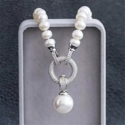 Long Pearl String with a Silver Broach