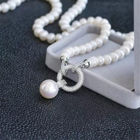 Long Pearl String with a Silver Broach